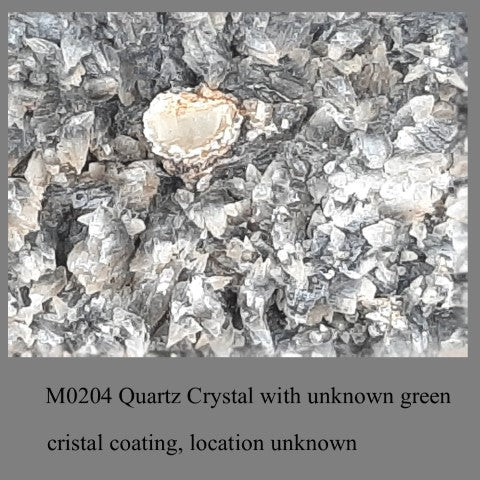 M0204 Quartz Crystal with unknown green cristal coating